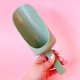 A scoop sand toy for children in light green eco plastic