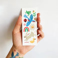 Temporary Tattoo sheet with birds, animals, flowers, and rainbow illustrations