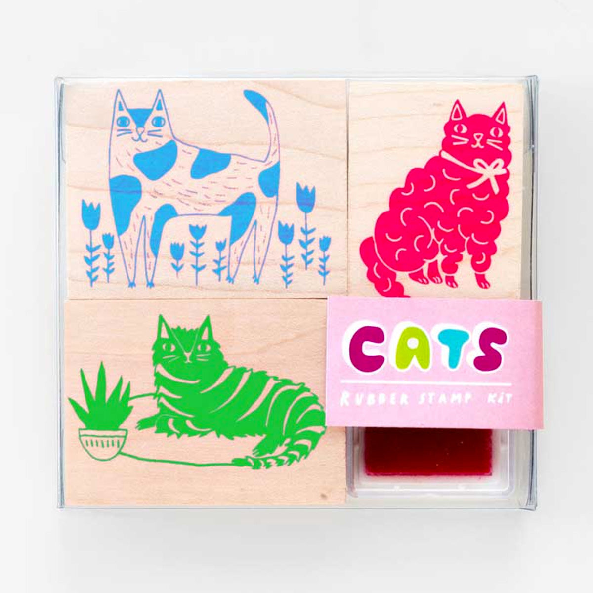 Three different rubber stamp images of cats with a neon pink ink pad